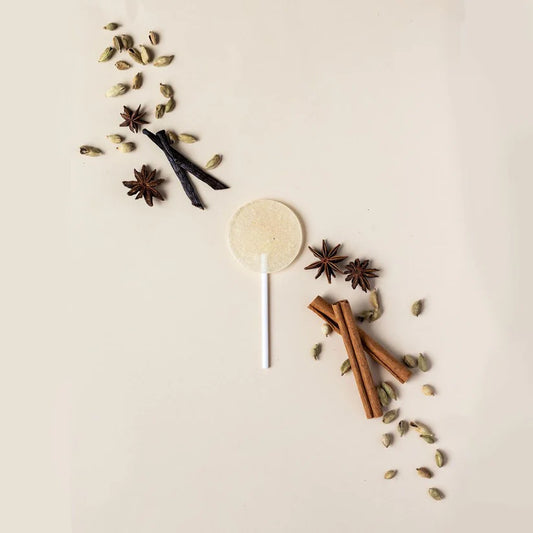 Spices and a lollipop on a light background