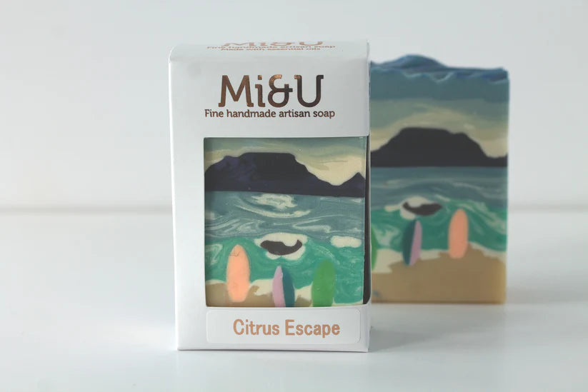 Mi&U handmade artisan soap with packaging featuring a beach scene.