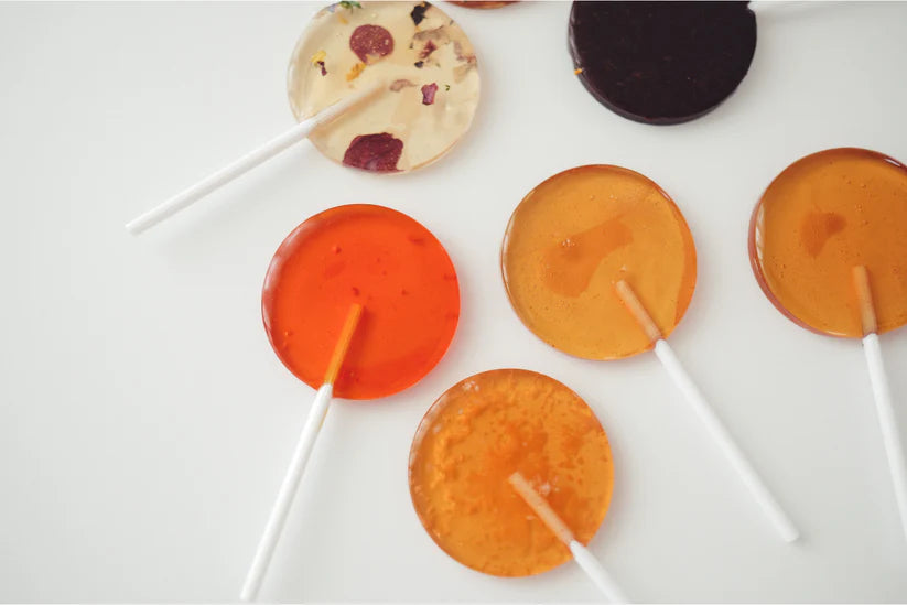 Colorful round lollipops on a white background