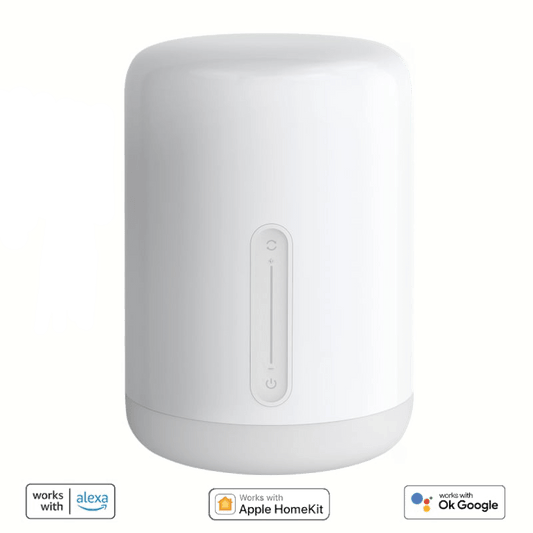 White cylindrical device with Alexa and Google Assistant logos on a beige background